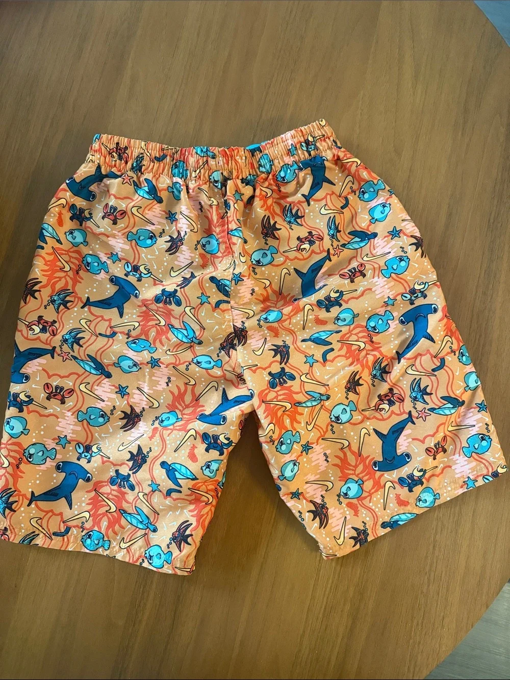 Nike Orange Swim Trunks with Blue Sea Creature Print. 7inch lined